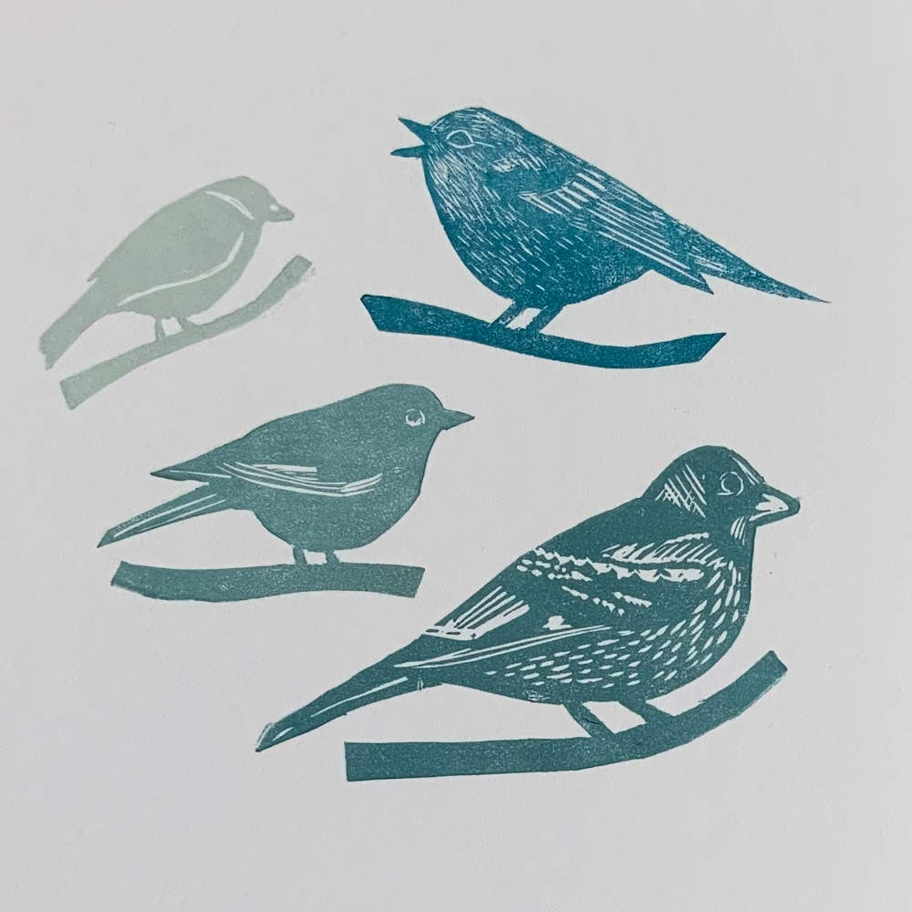 Birds on branches in blue